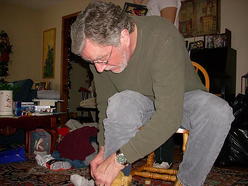 Dad putting on his new boots